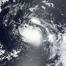 A satellite imagery of a swirling mass of clouds over the open Atlantic.