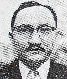 A halftoned image of a man with short hair and glasses looking ahead.