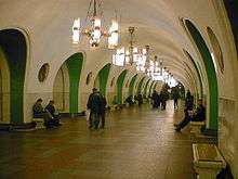 Wide, round-ceilinged hallway of VDNKh Metro station
