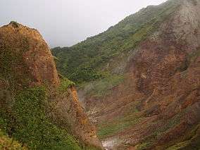 Valley and reddish rocks.