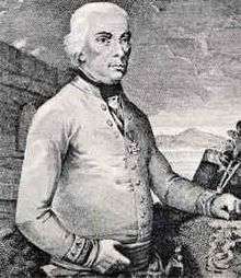Black and white print shows a white-haired man in a white military coat. He has his right thumb tucked into his belt while his left hand rests on a table.