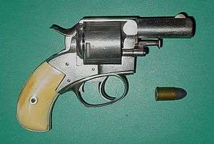 Snub-nosed revolver with yellow handle and its bullet
