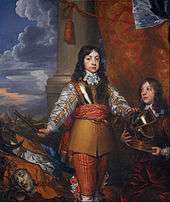 Charles as a boy with shoulder-length black hair and standing in a martial pose
