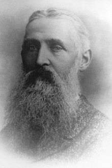 Portrait of an older man with a long beard