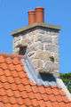 Witches' stones on tiled roof Jersey.jpg