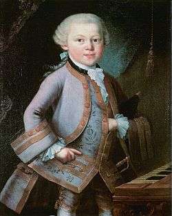 a child (Mozart) in formal embroidered 18th century costume, left hand thrust into his waistcoat. He looks directly outr of the picture, although his body is turned towards the right.