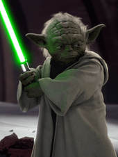 Yoda holding a lightsaber